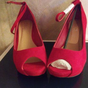 Red wedge pumps